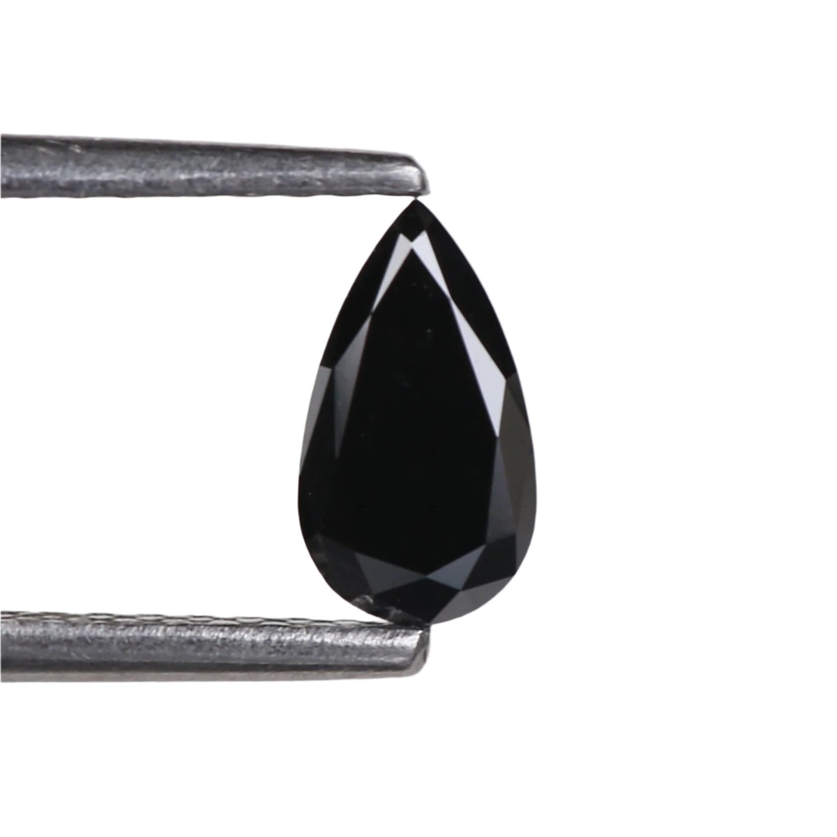 Teardrop-shaped black gemstone held between tweezers on a light gray background