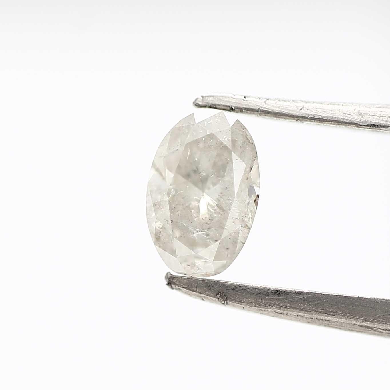 0.49 Carat Milky Gray Oval Shape Salt and Pepper Diamond 6 MM