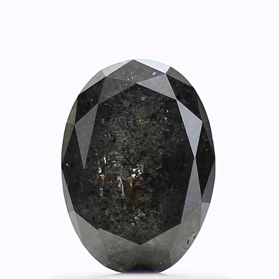 Faceted black diamond on a white background