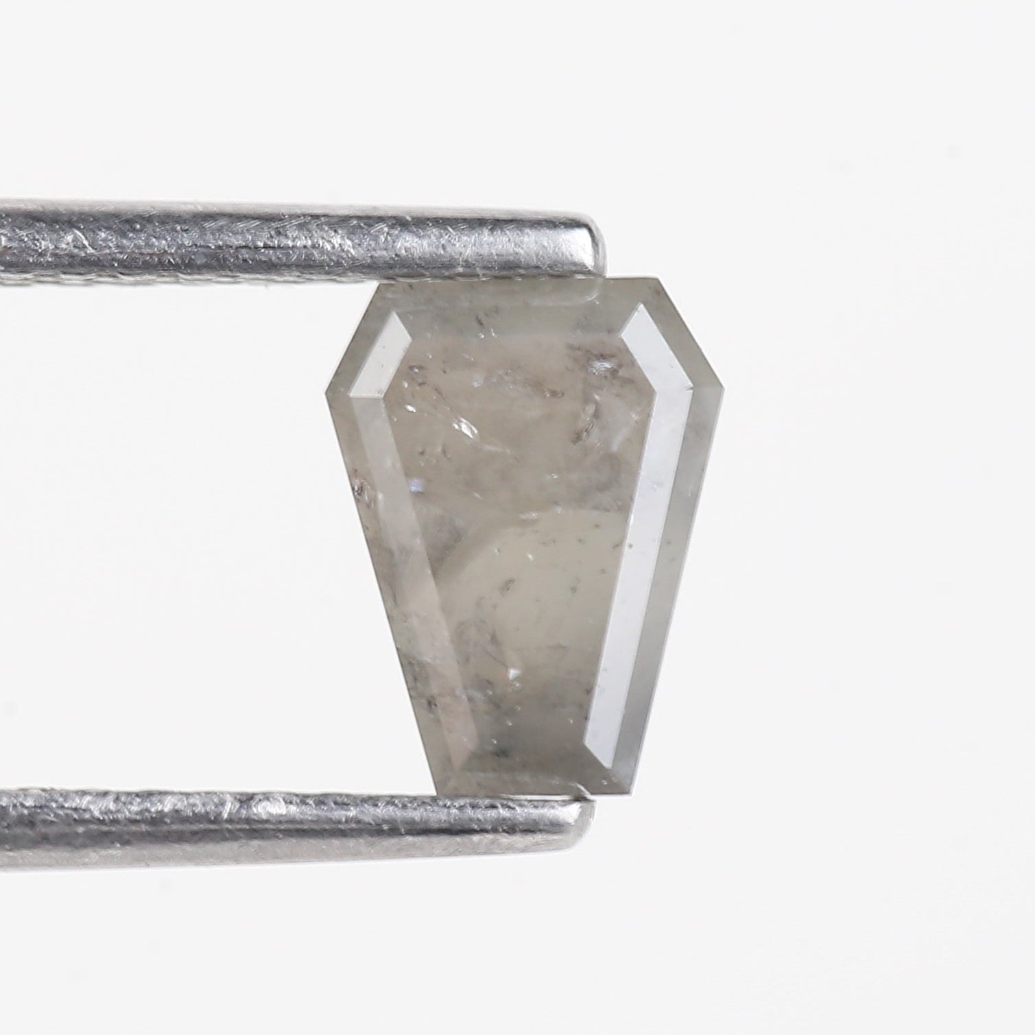 Close-up of a metal rod with a hexagonal metal object attached on a white background