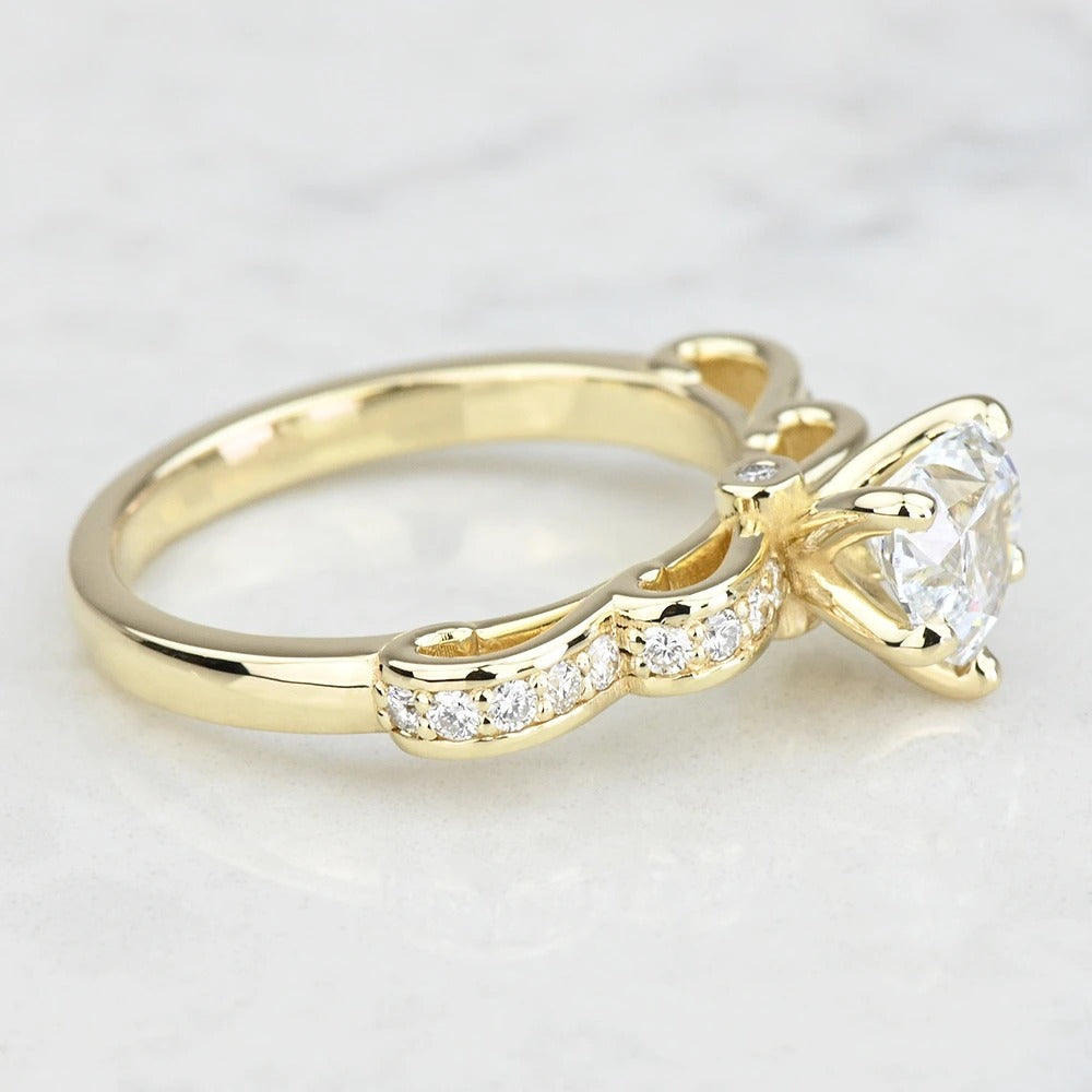 Gold ring with a diamond on a light gray background