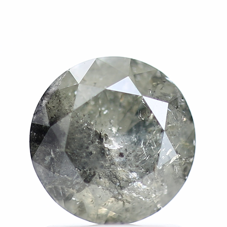 Round cut diamond with visible inclusions on a white background
