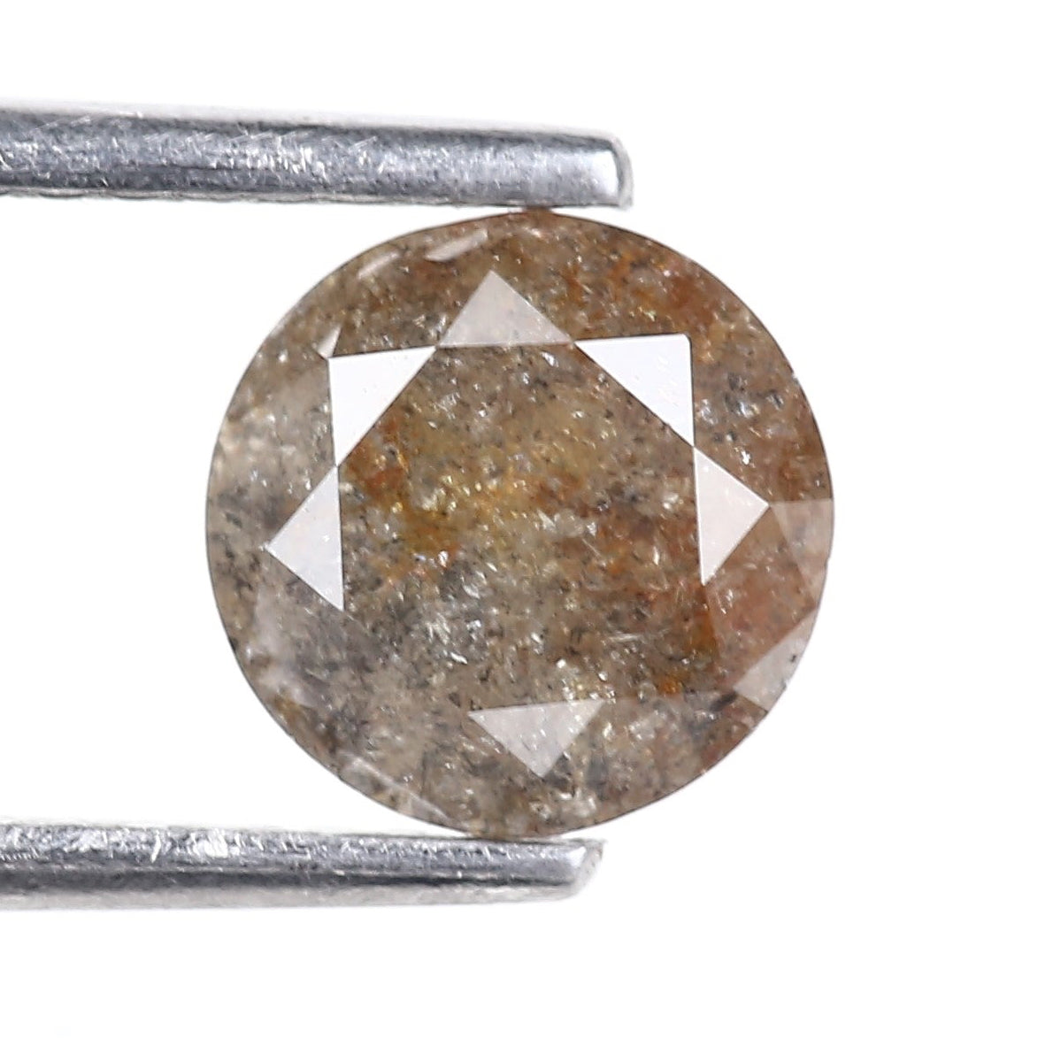 Brown diamond with a star pattern held between two metal rods on a white background