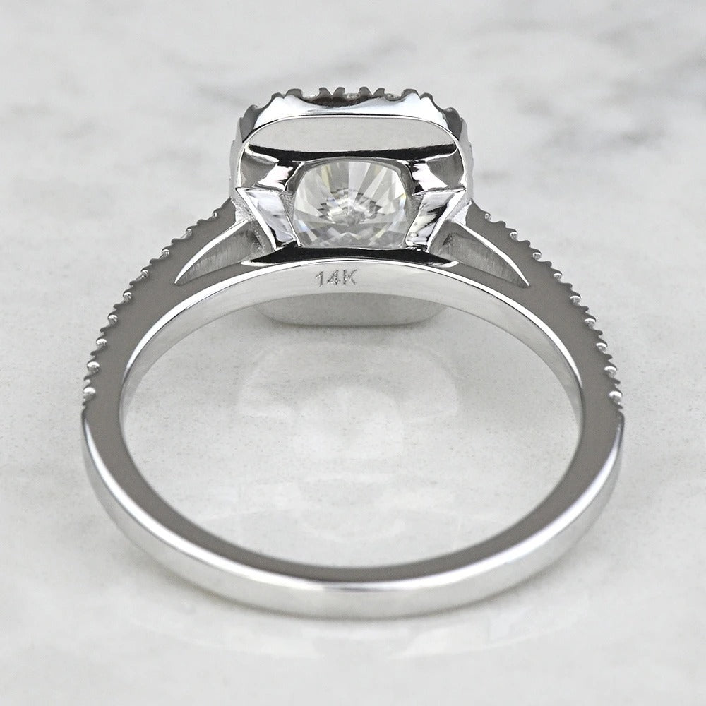 Silver ring with a diamond on a light gray background