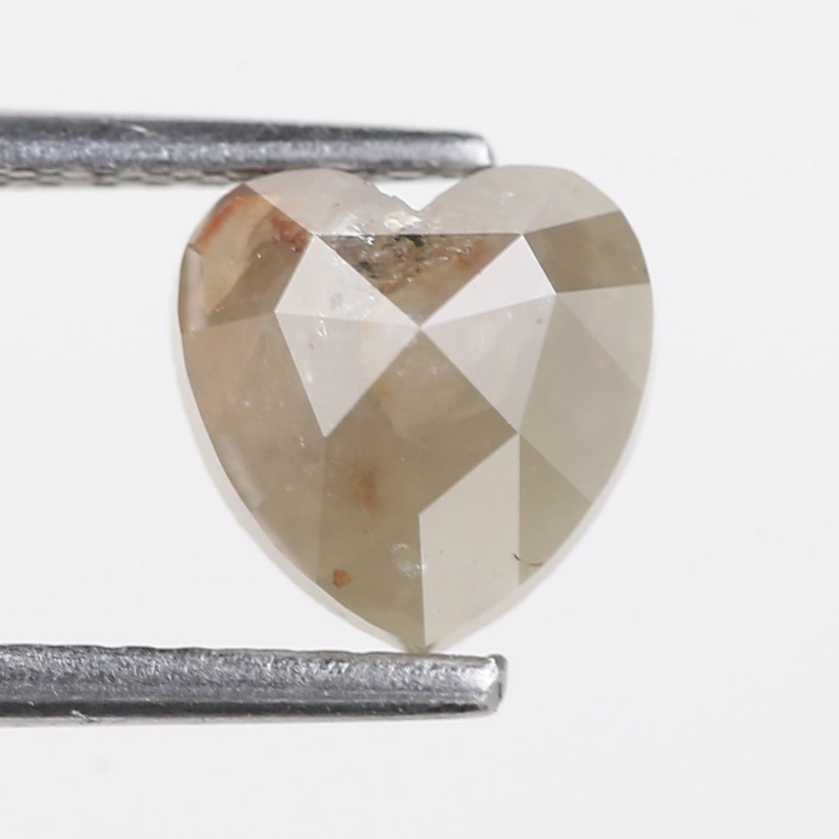 Heart-shaped diamond on a white background
