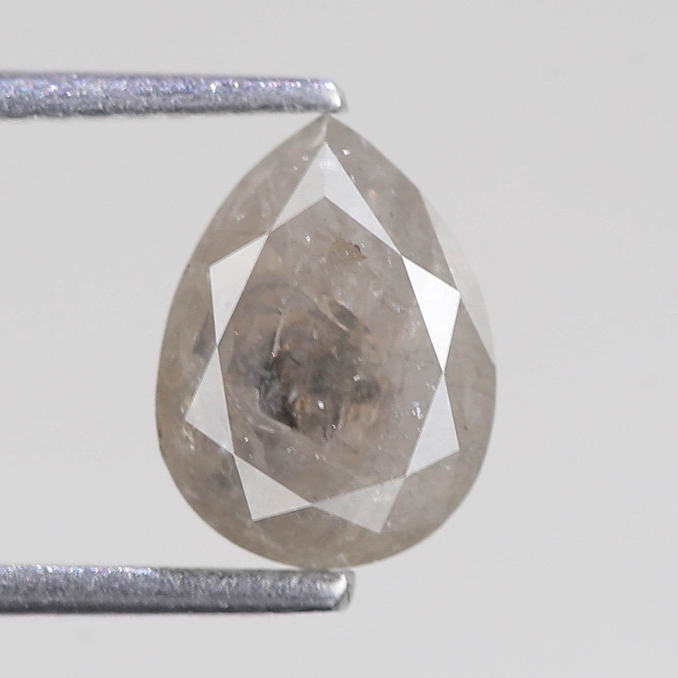 Teardrop-shaped diamond on a white background