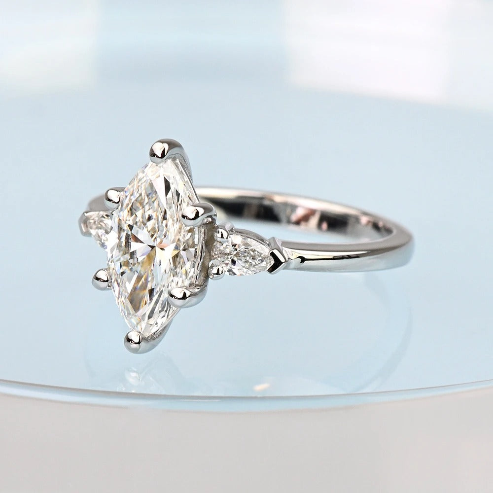 Pear-shaped diamond ring on a light background