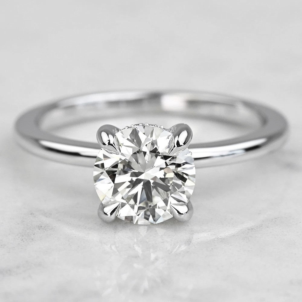 solitaire Diamond ring on a light gray background