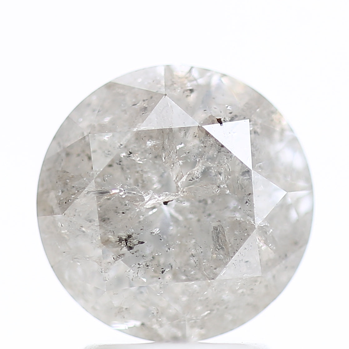 Round diamond with visible inclusions on a white background