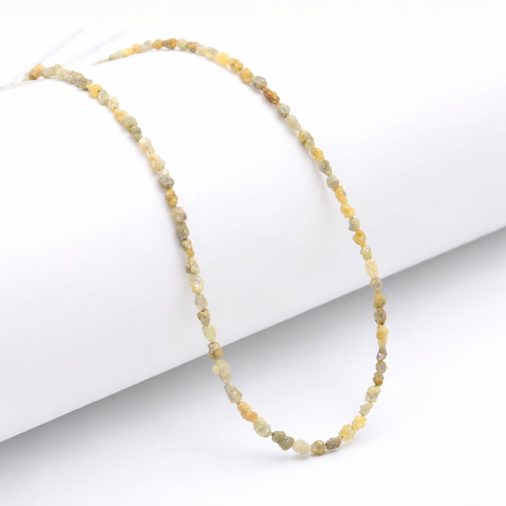 Necklace with small beads on a white background