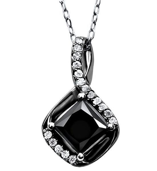 Black gemstone pendant with diamond accents on a white backgroundt