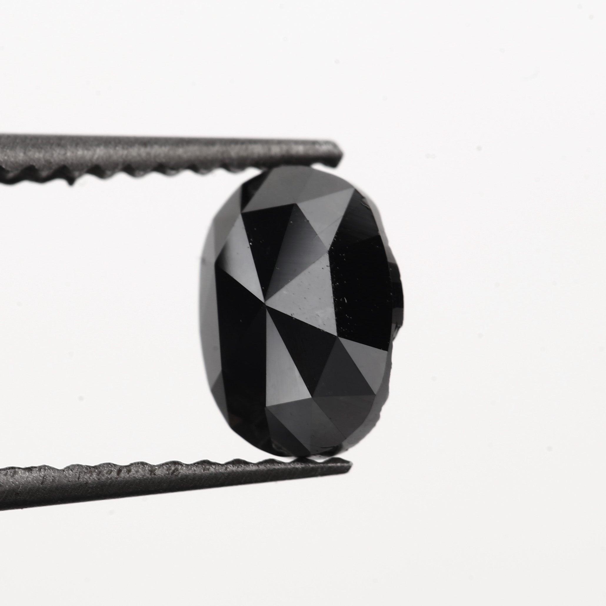oval black diamond engagement ring