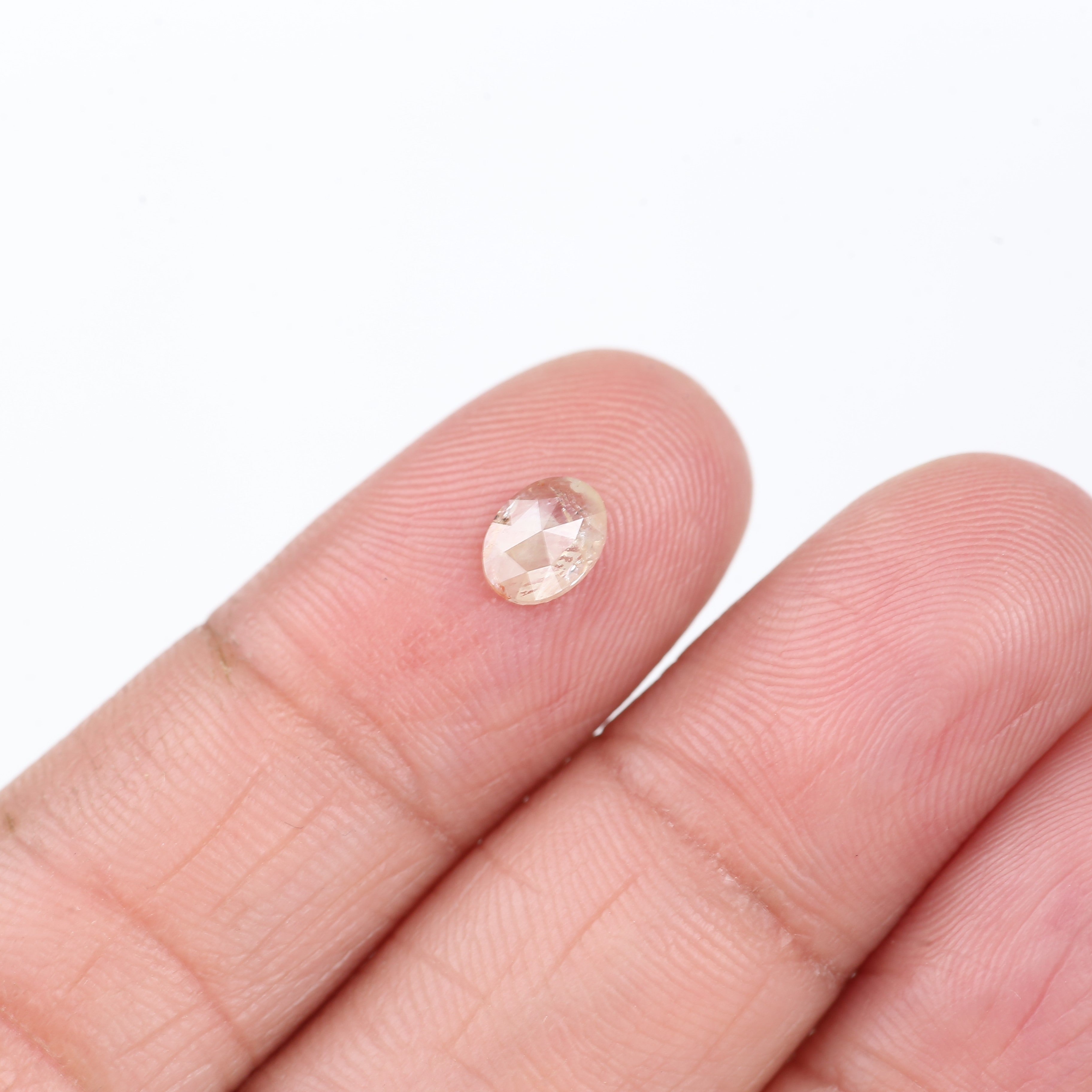 0.48 Carat Natural Light Orange Oval Cut Salt And Pepper Diamond 6.09 MM