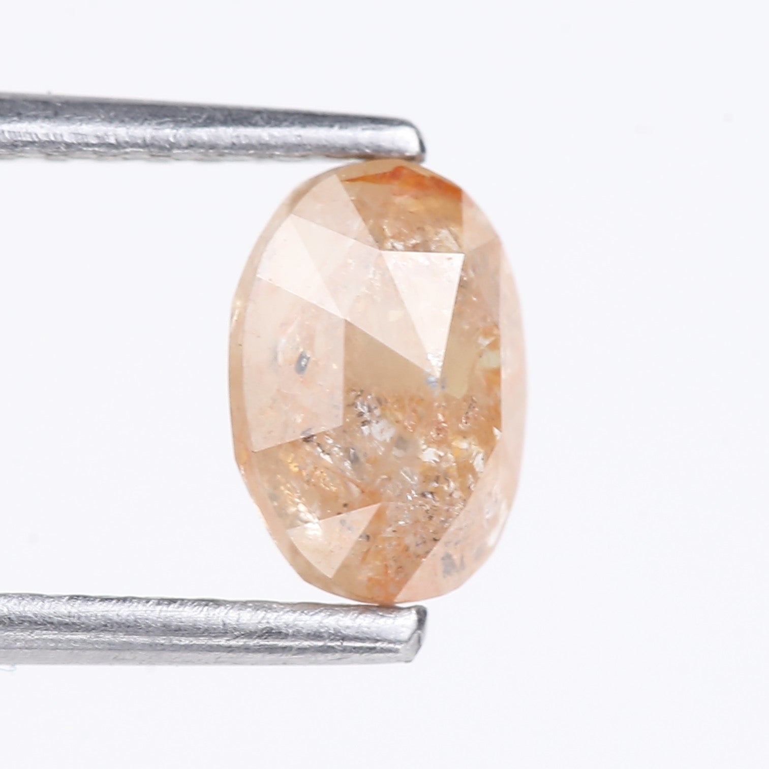 0.91 Carat Natural Light Orange Oval Cut Salt And Pepper Diamond 6.92 MM