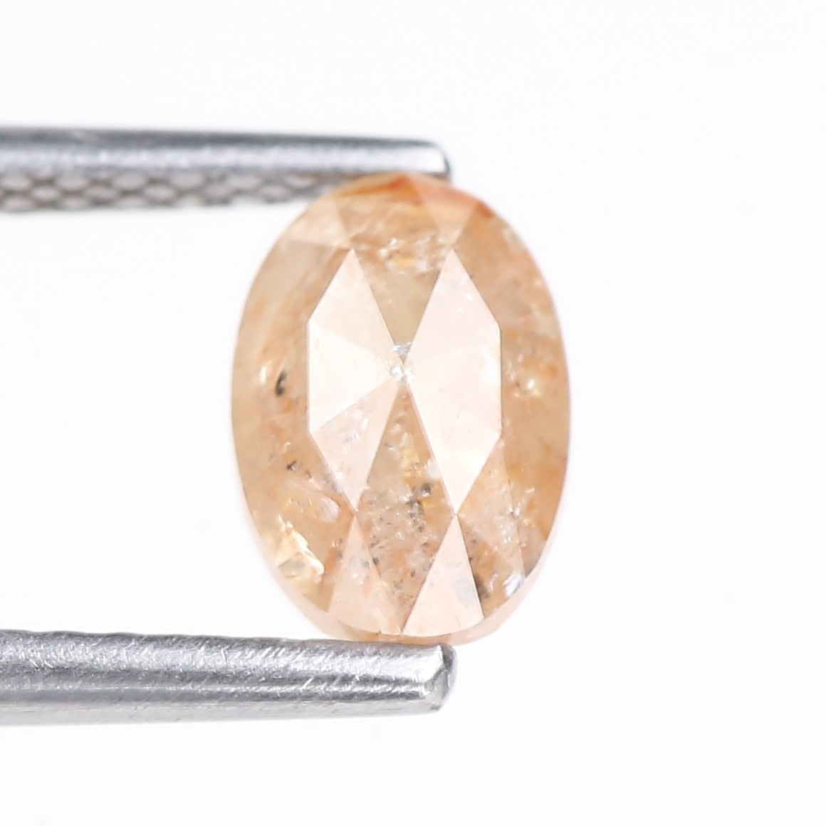 0.91 Carat Natural Light Orange Oval Cut Salt And Pepper Diamond 6.92 MM