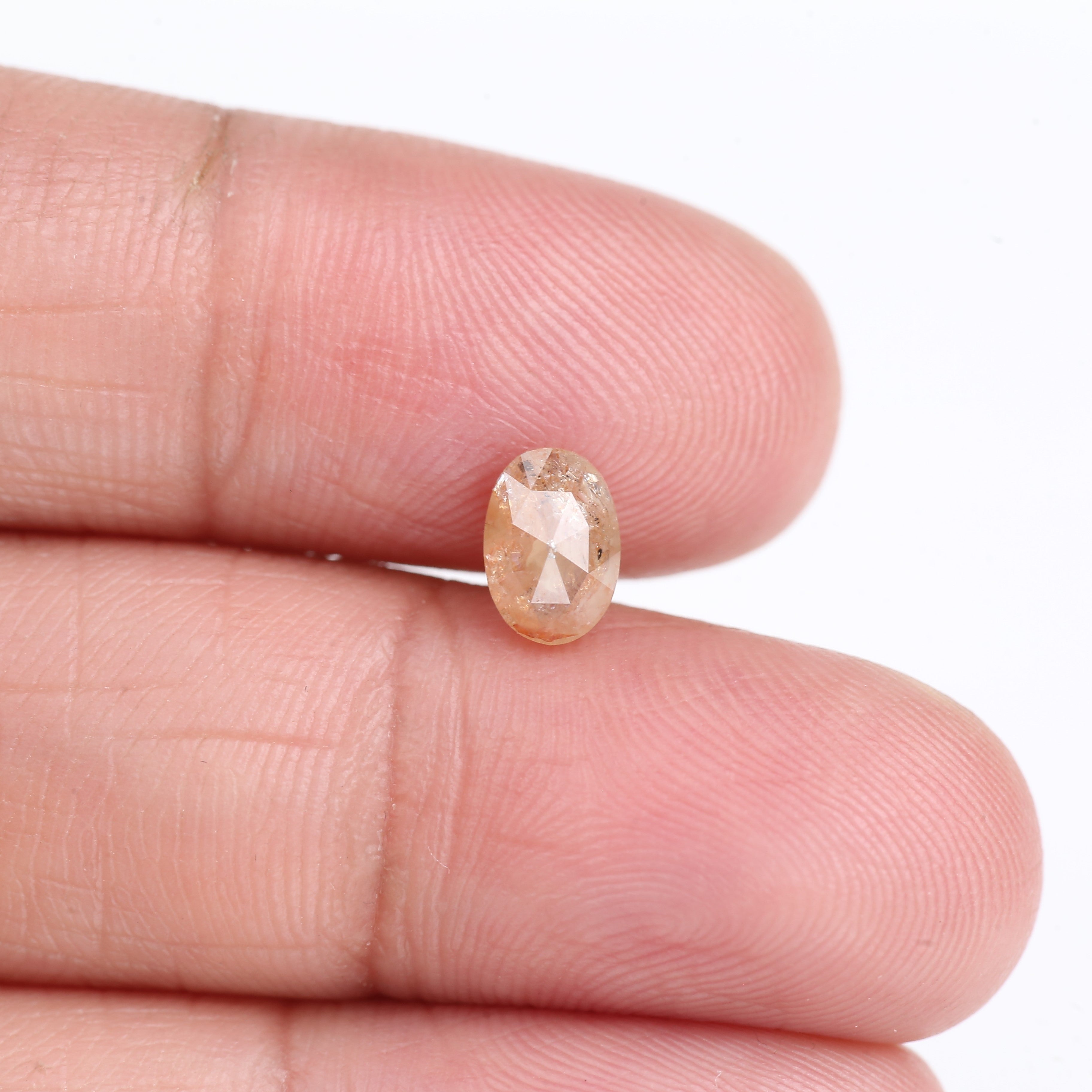 0.91 Carat Natural Light Orange Oval Cut Salt And Pepper Diamond 6.92 MM
