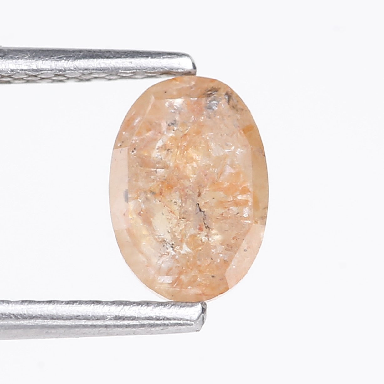 0.91 Carat Natural Light Orange Oval Cut Salt And Pepper Diamond 6.92 MM