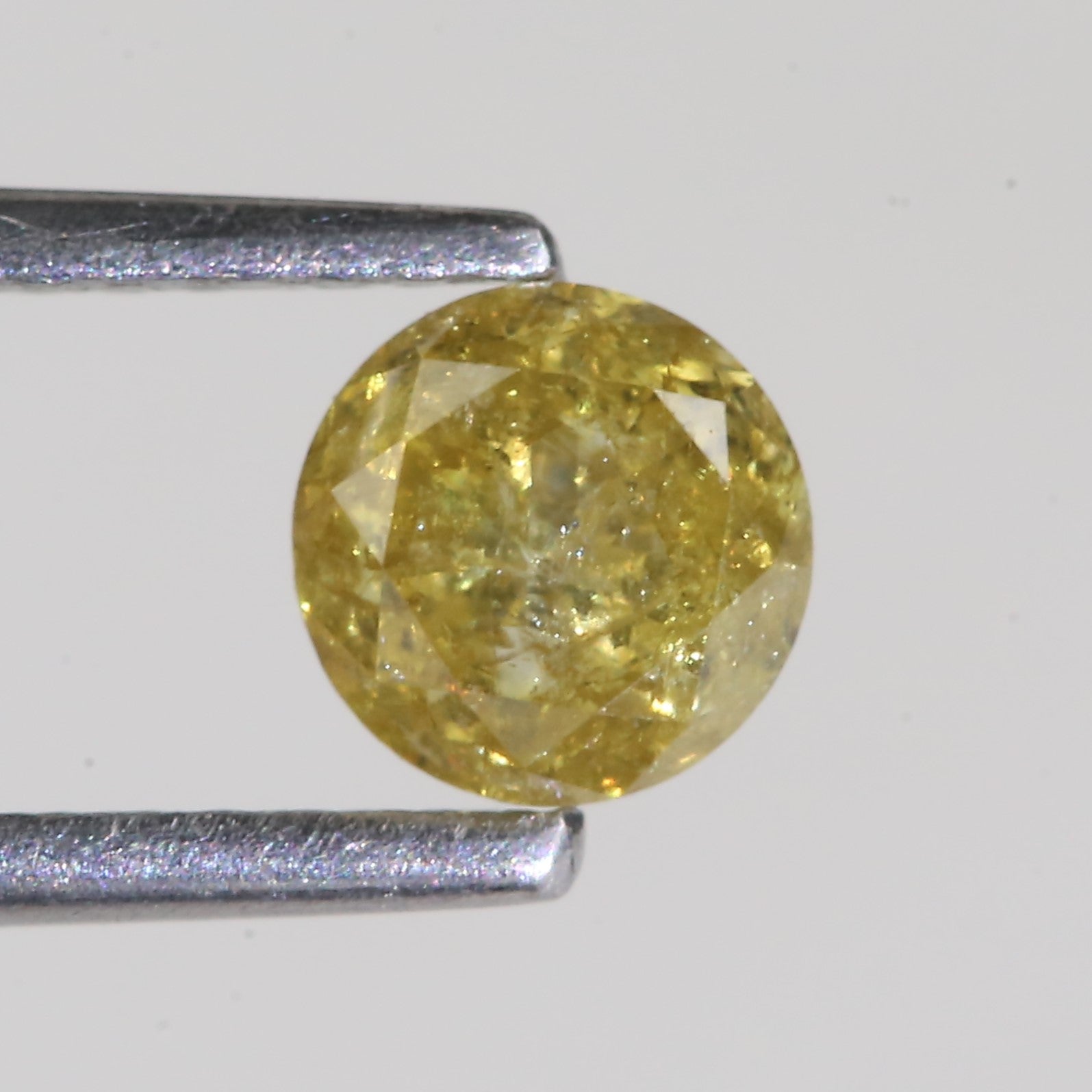 0.59 Carat Natural Salt And Pepper Round Cut Yellow Diamond 4.97 MM