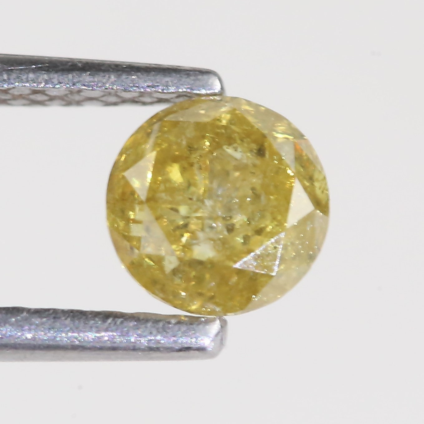 0.59 Carat Natural Salt And Pepper Round Cut Yellow Diamond 4.97 MM