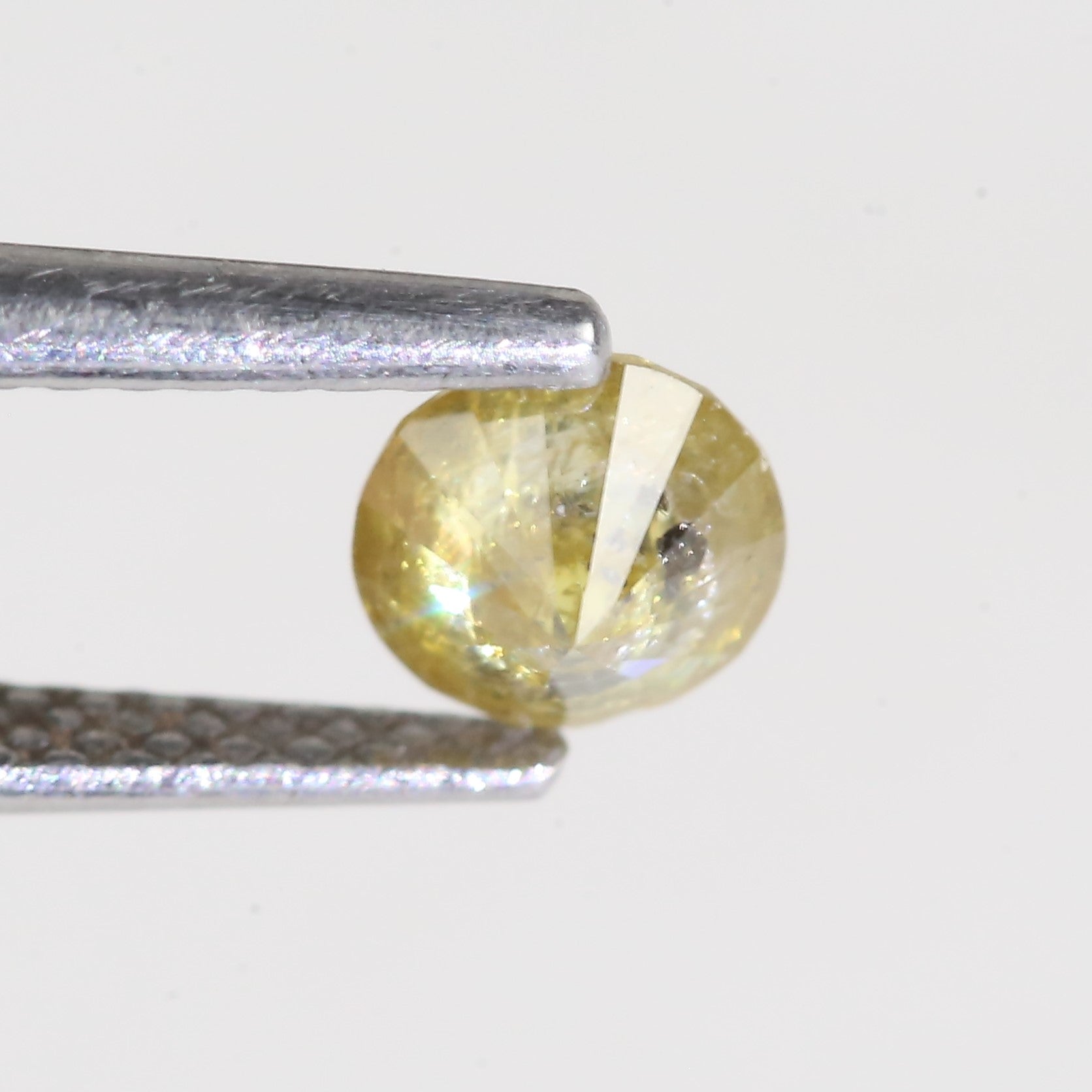 0.59 Carat Natural Salt And Pepper Round Cut Yellow Diamond 4.97 MM