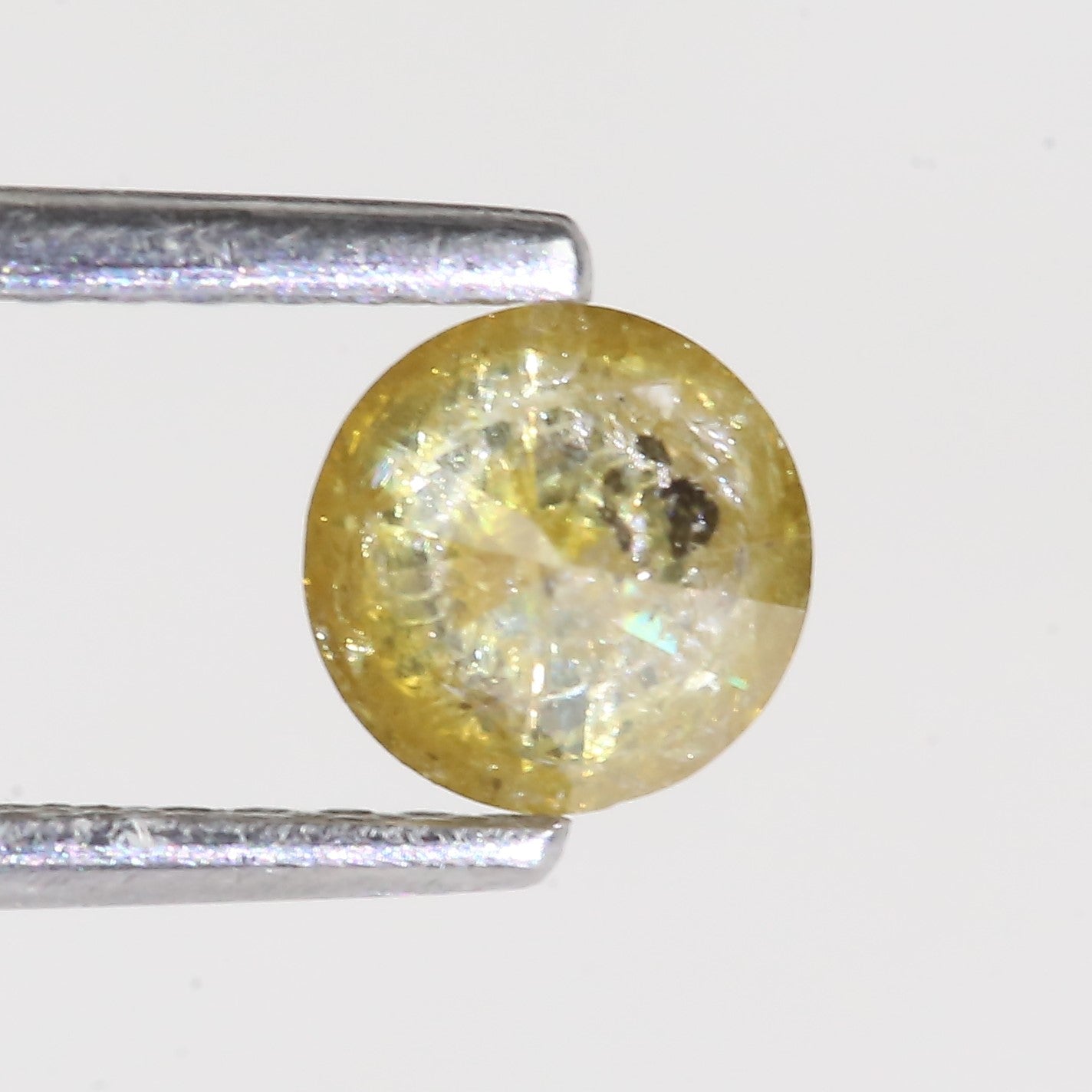 0.59 Carat Natural Salt And Pepper Round Cut Yellow Diamond 4.97 MM