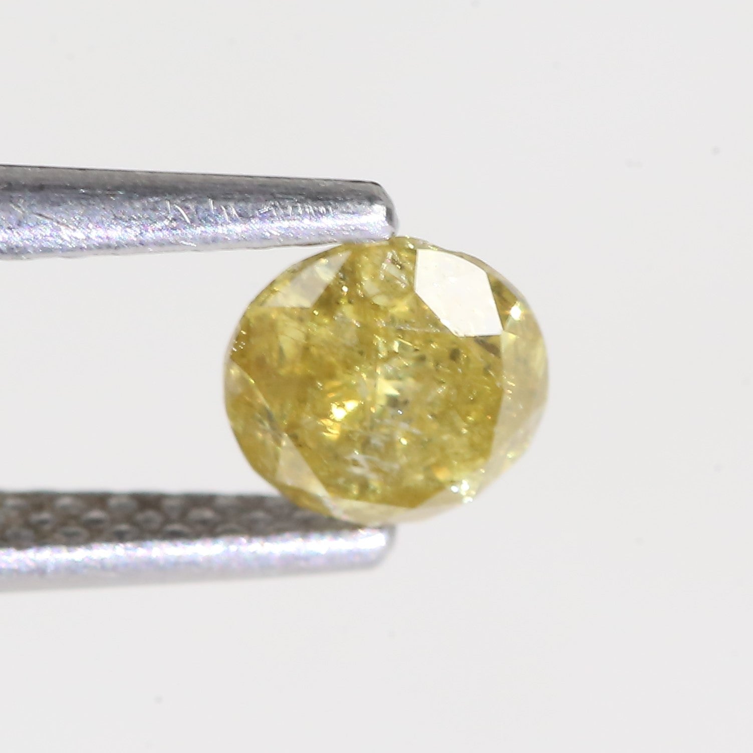0.59 Carat Natural Salt And Pepper Round Cut Yellow Diamond 4.97 MM