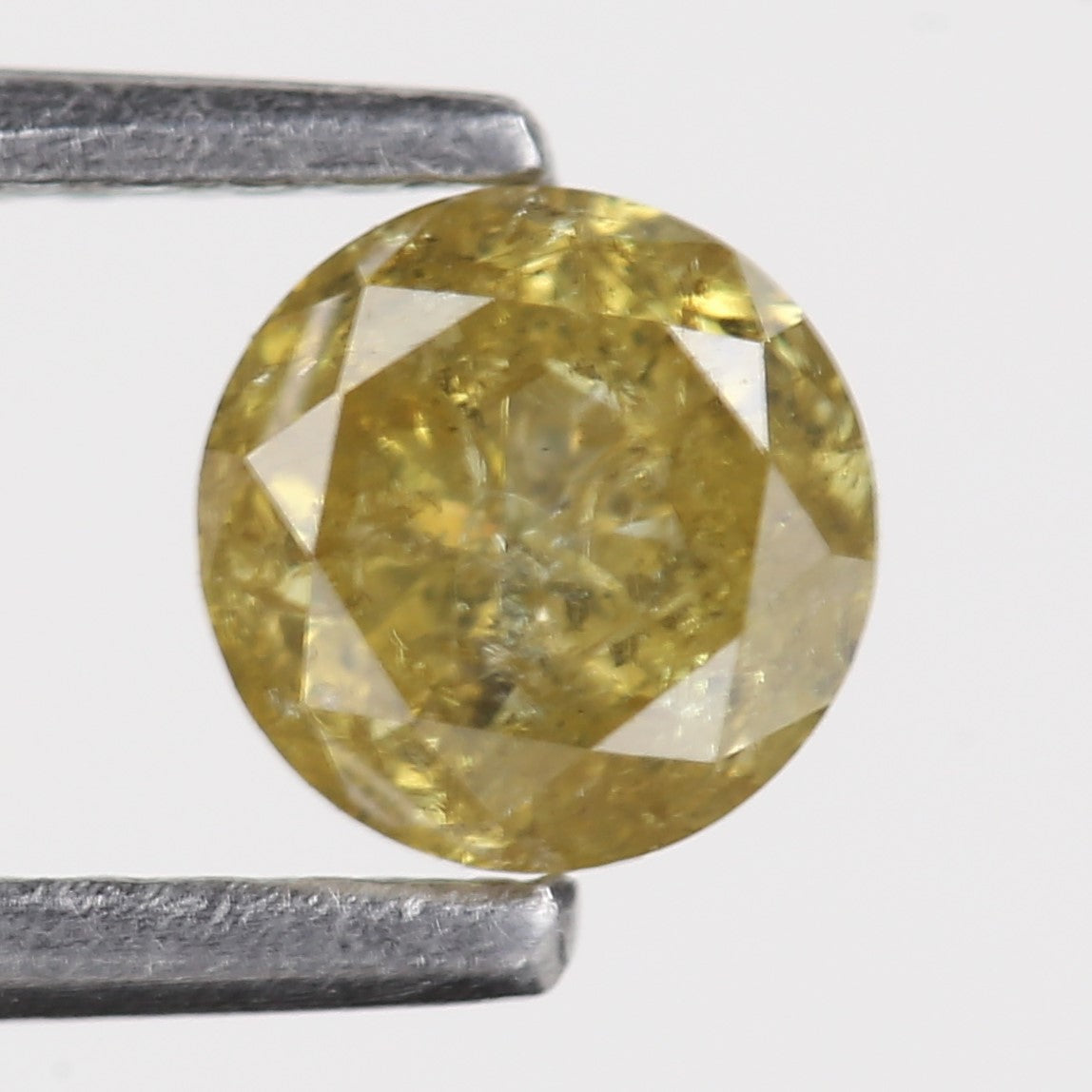 0.59 Carat Natural Salt And Pepper Round Cut Yellow Diamond 4.97 MM