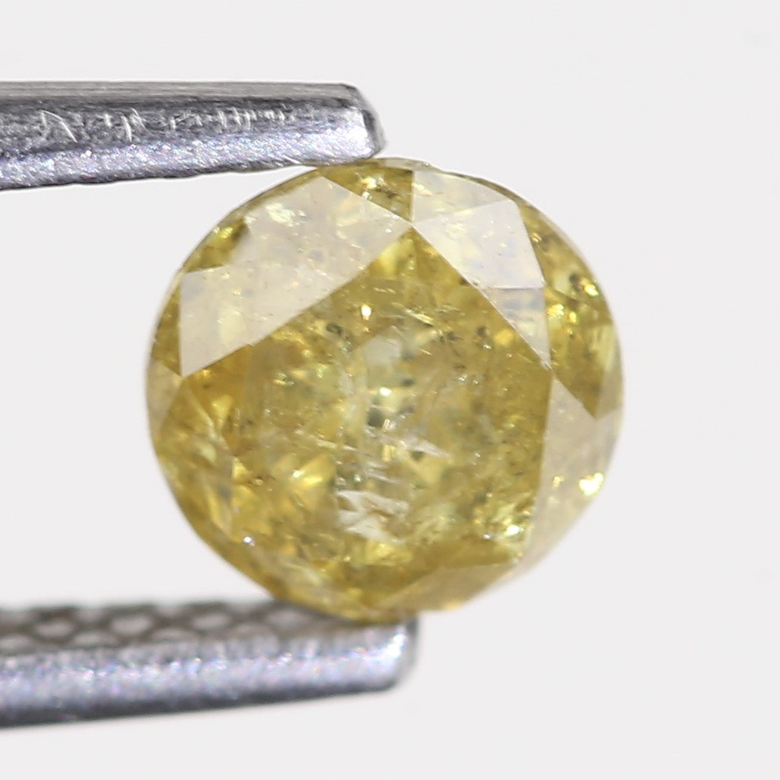 0.59 Carat Natural Salt And Pepper Round Cut Yellow Diamond 4.97 MM