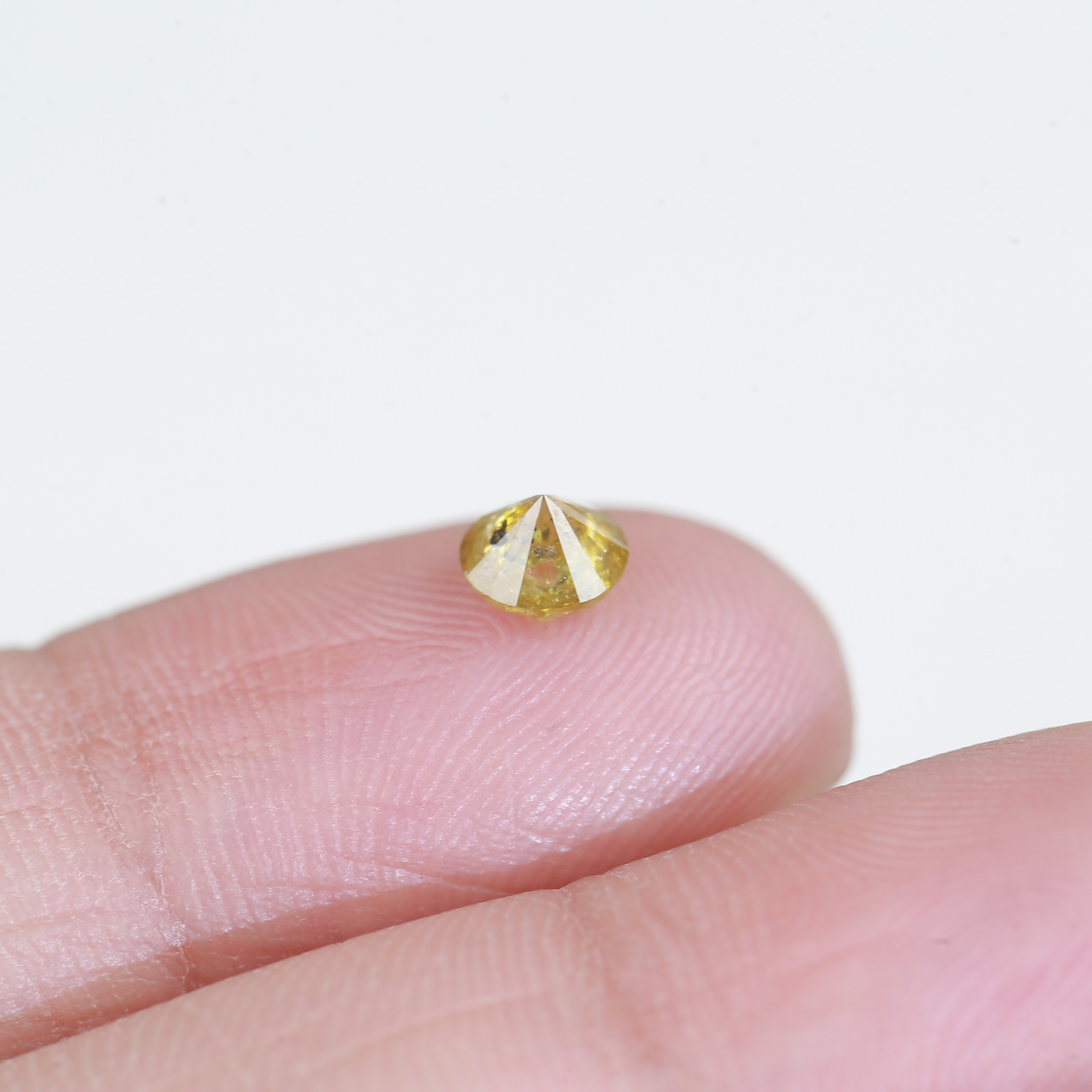 0.59 Carat Natural Salt And Pepper Round Cut Yellow Diamond 4.97 MM