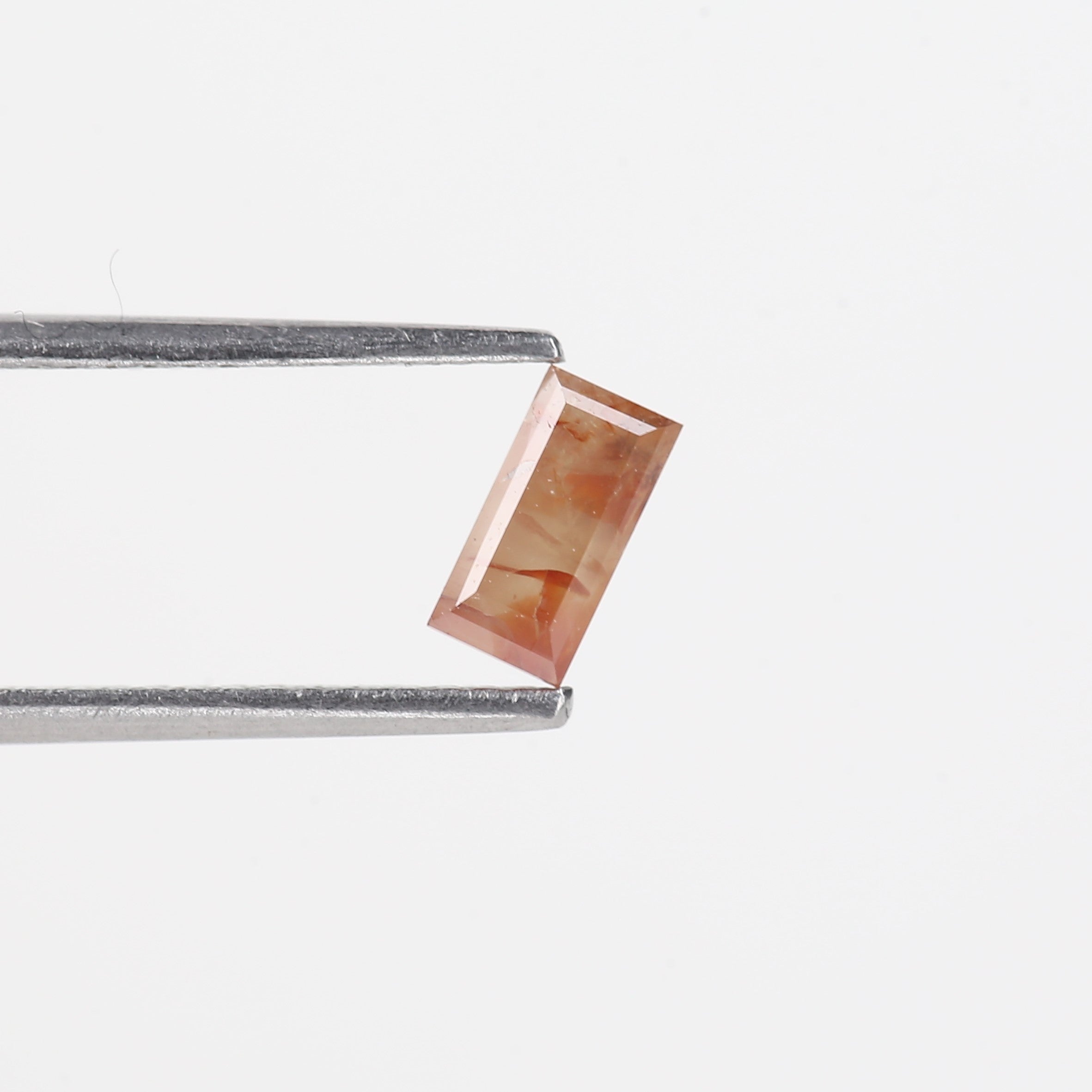 0.44 Carat Natural Orange Baguette Natural Salt And Pepper Diamond 6.07 MM