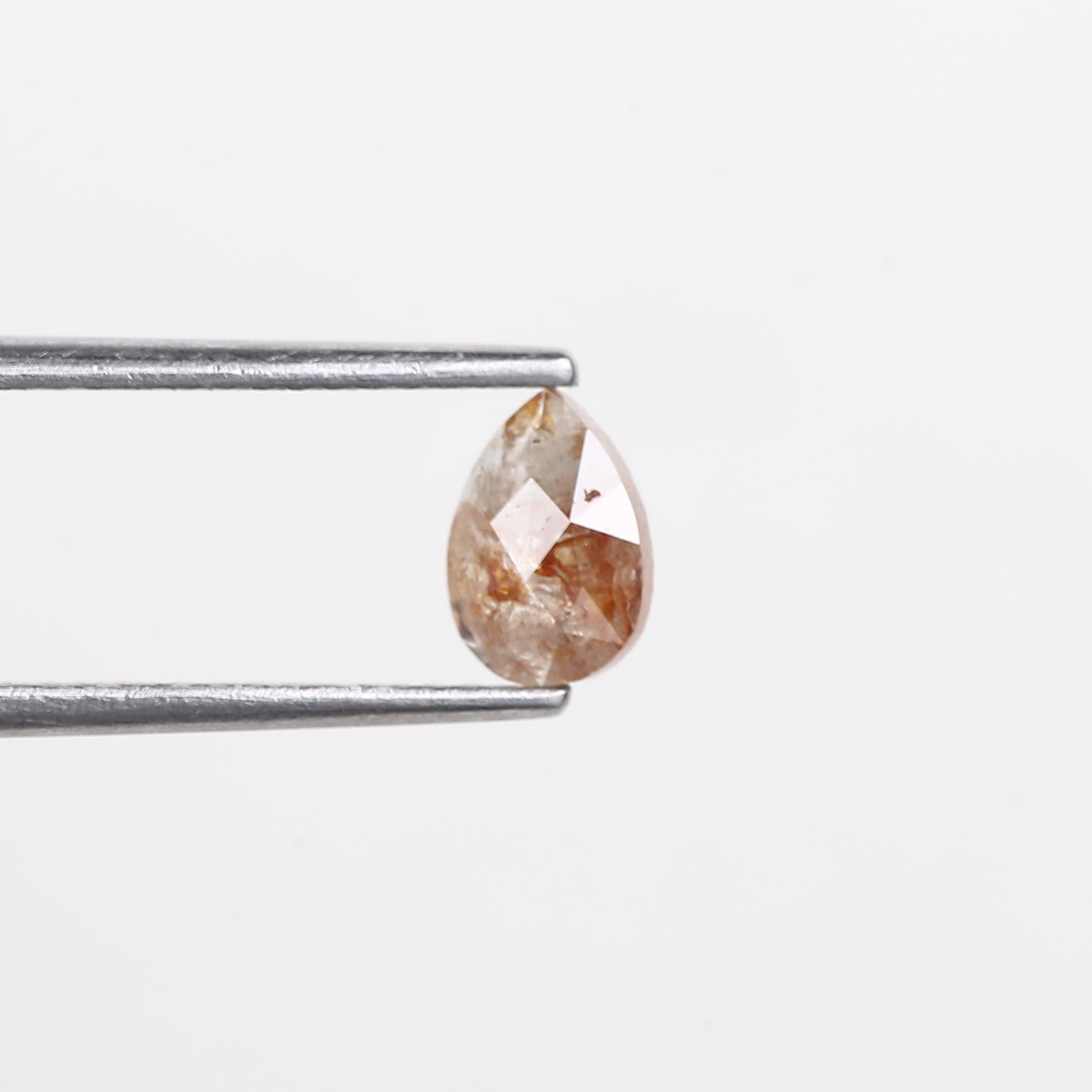 0.56 Carat Natural Orange Pear Salt Pepper Diamond 6.5 MM