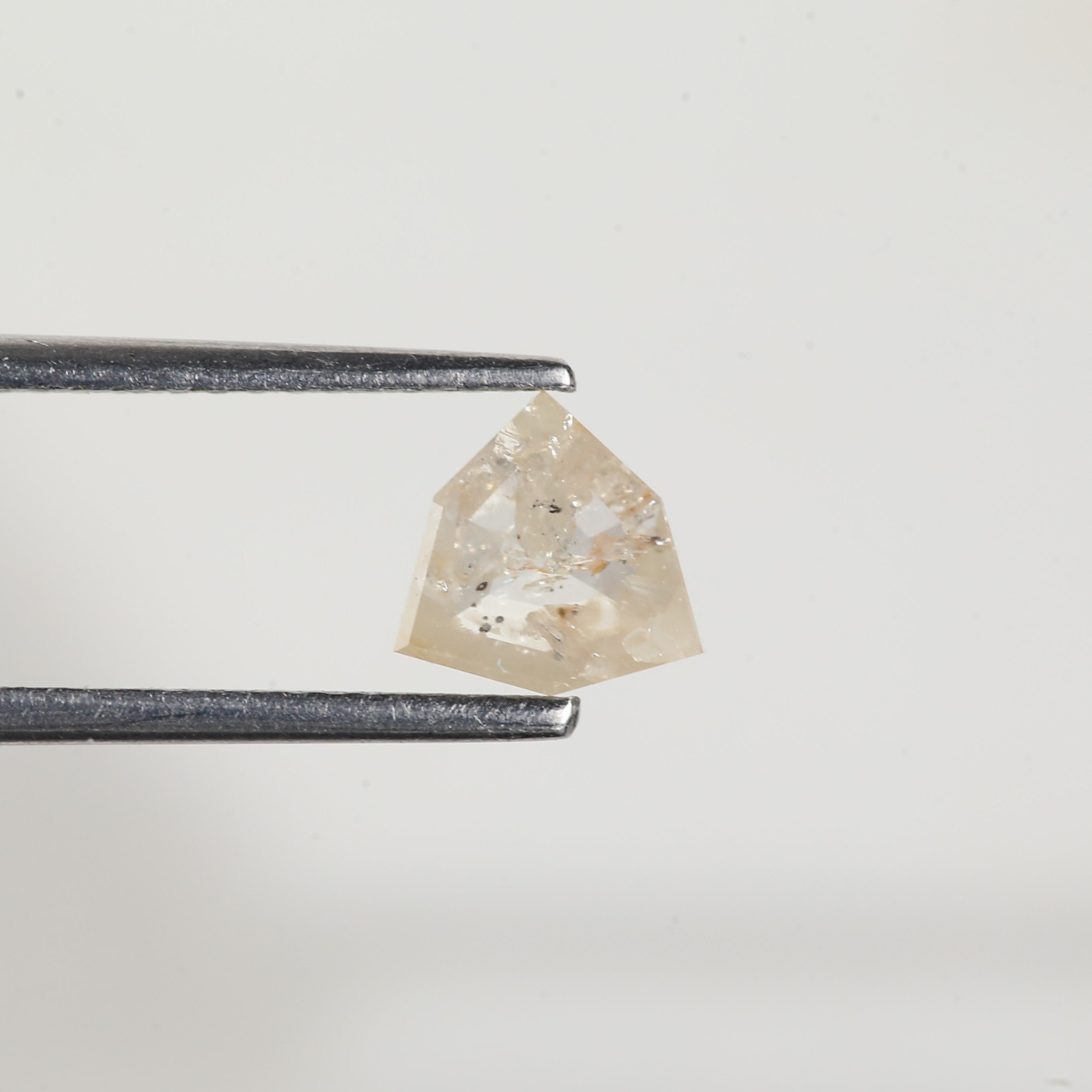 0.72 Carat Natural Shield Cut Orange Salt and Pepper Diamond 6.3 MM