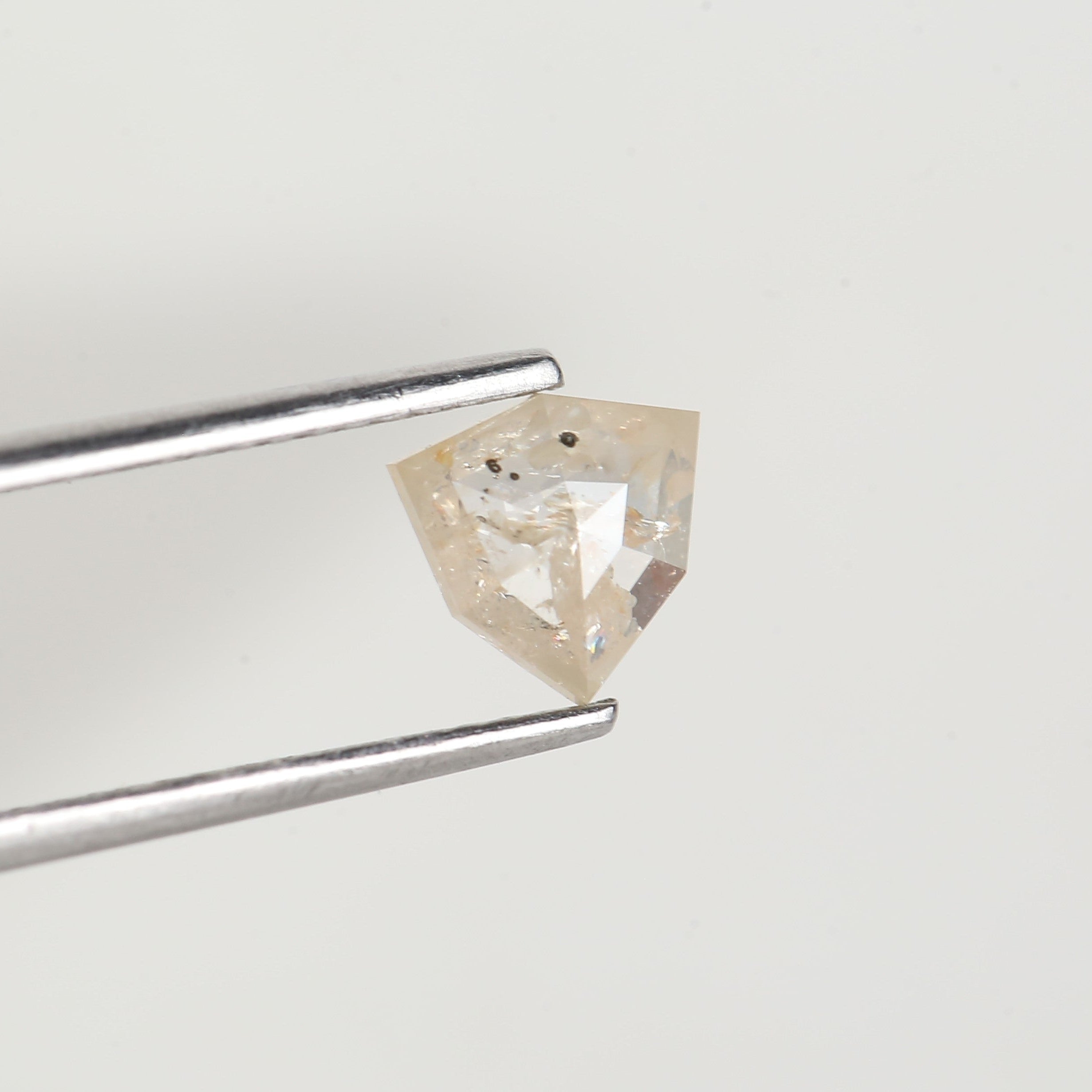 0.72 Carat Natural Shield Cut Orange Salt and Pepper Diamond 6.3 MM