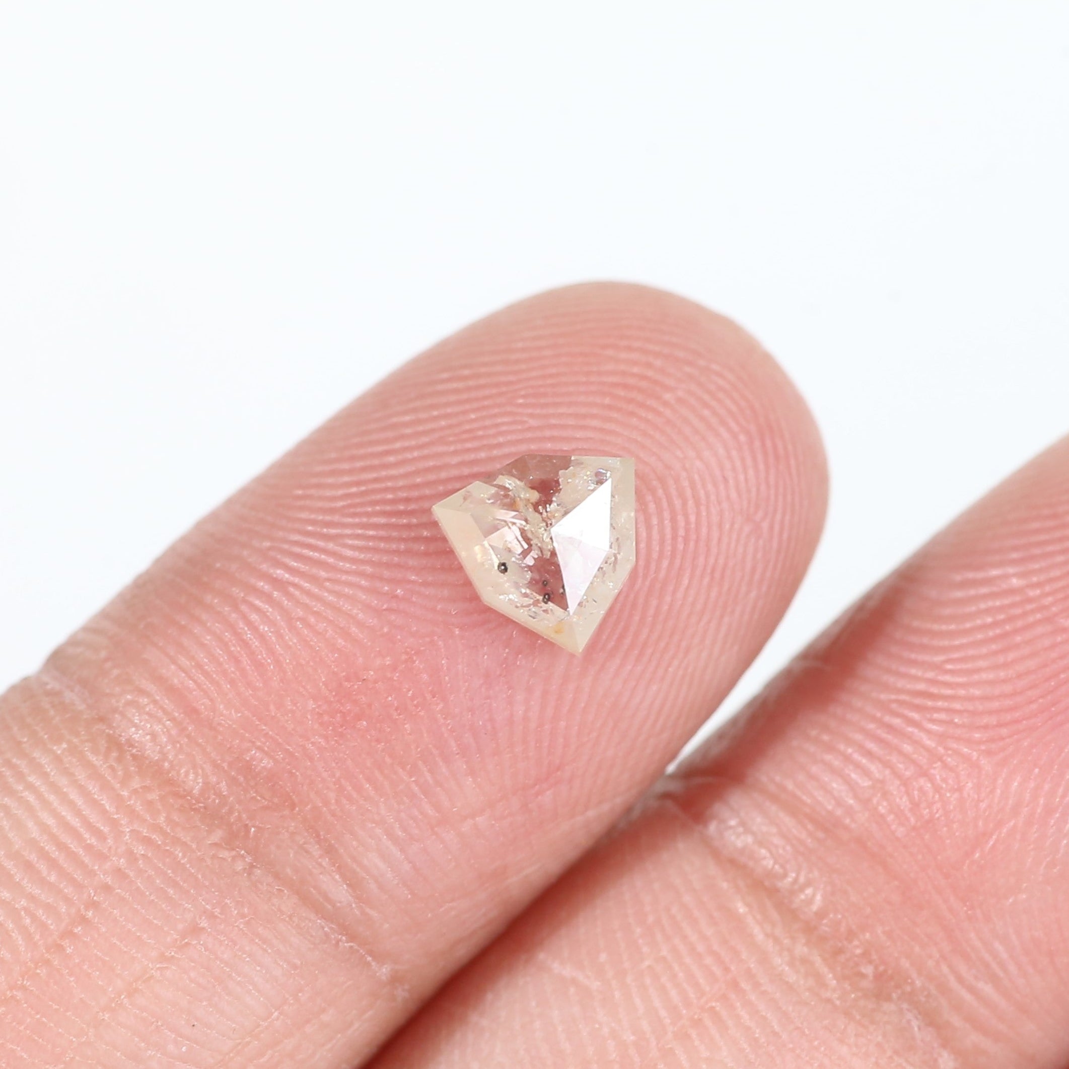 0.72 Carat Natural Shield Cut Orange Salt and Pepper Diamond 6.3 MM