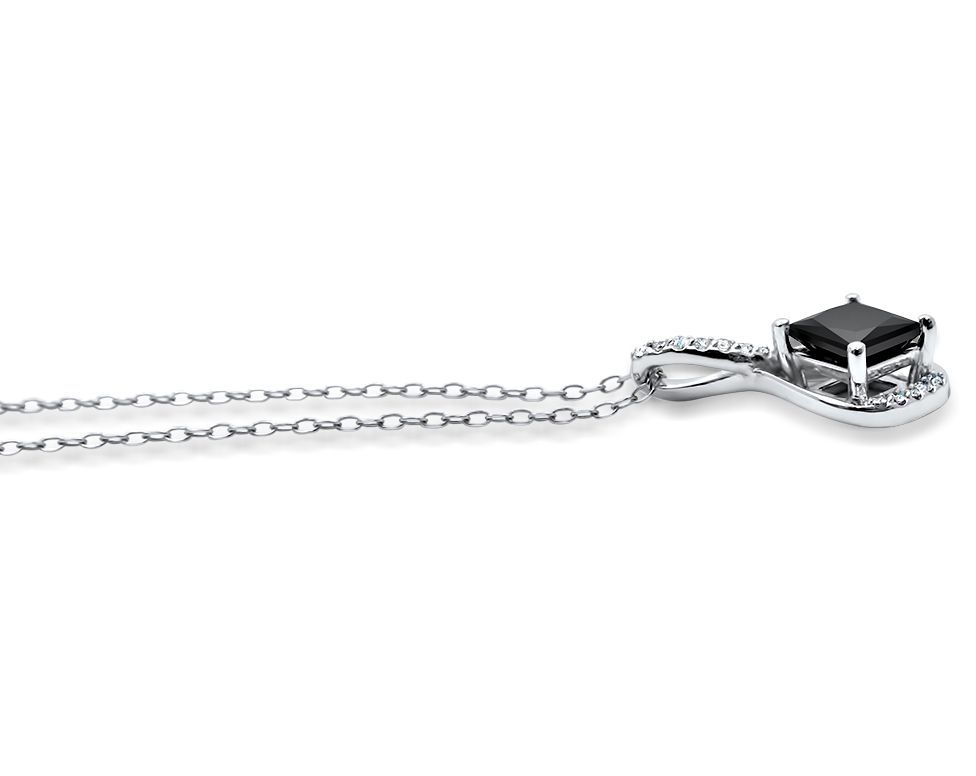 Silver necklace with a black gemstone pendant on a white background