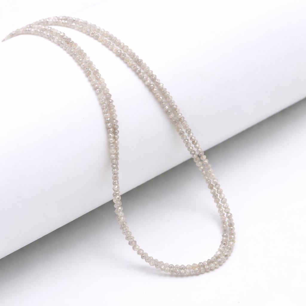 Pearl necklace on a white surface