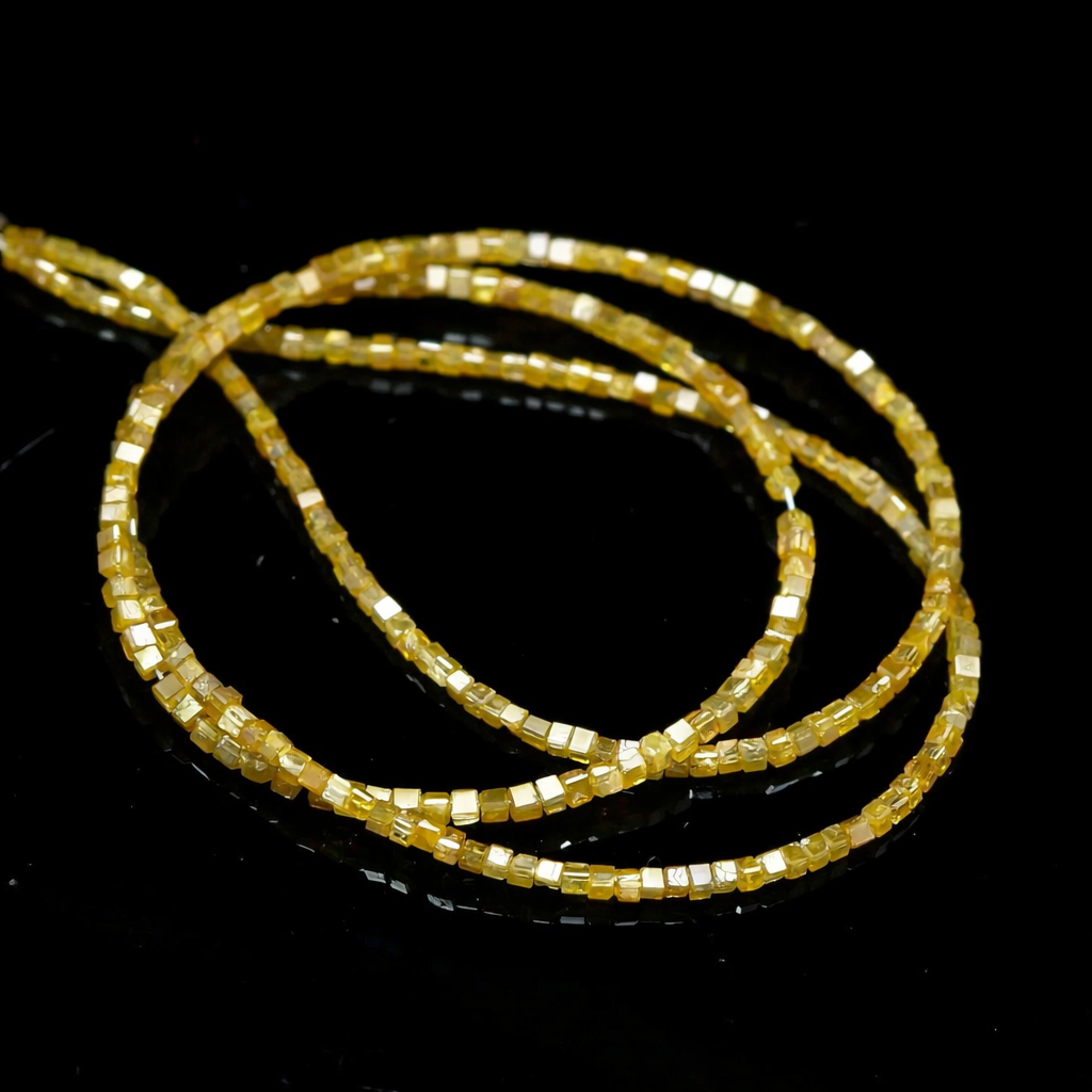 Three gold beaded bracelets on a black background