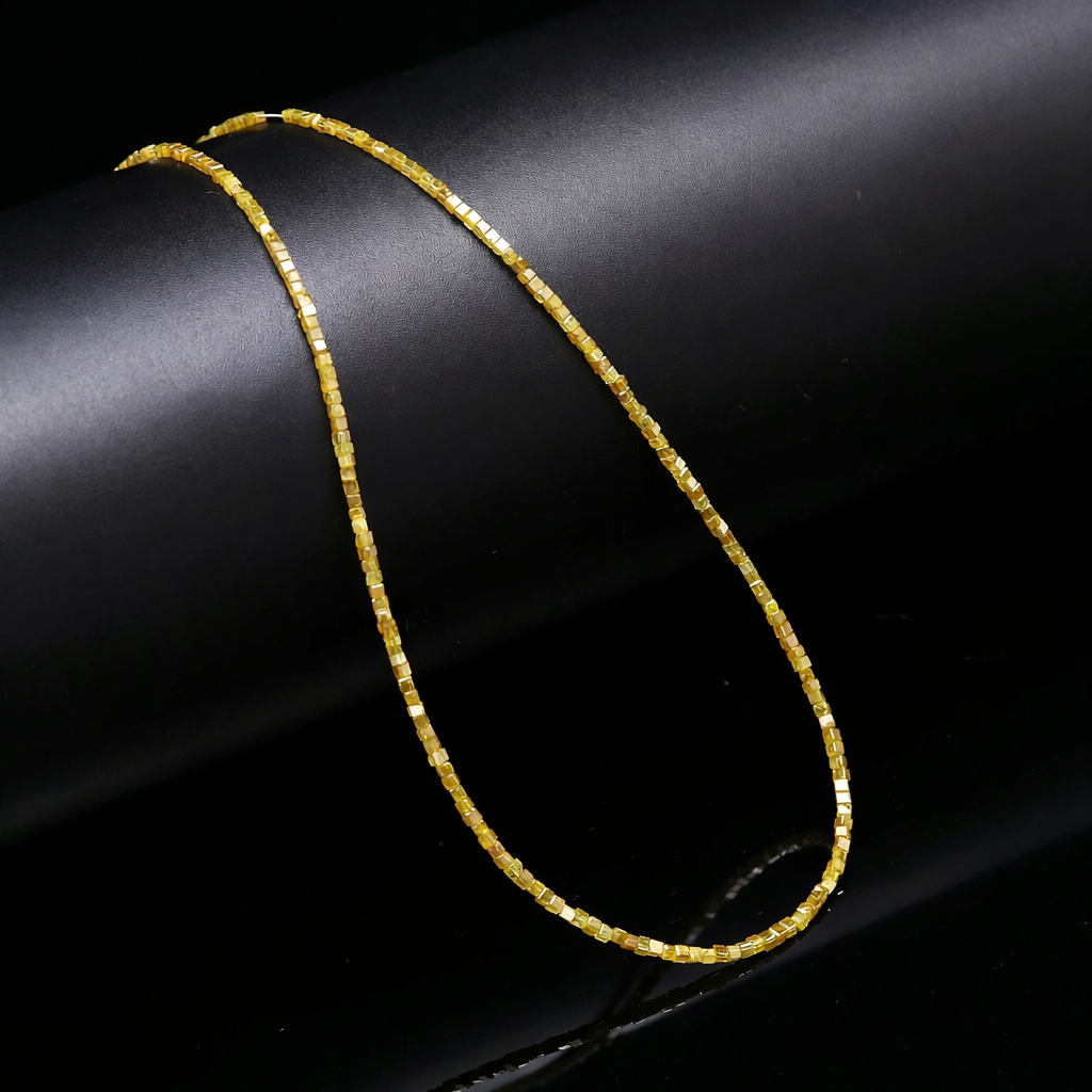 Yellow Diamond beaded necklace on a black background