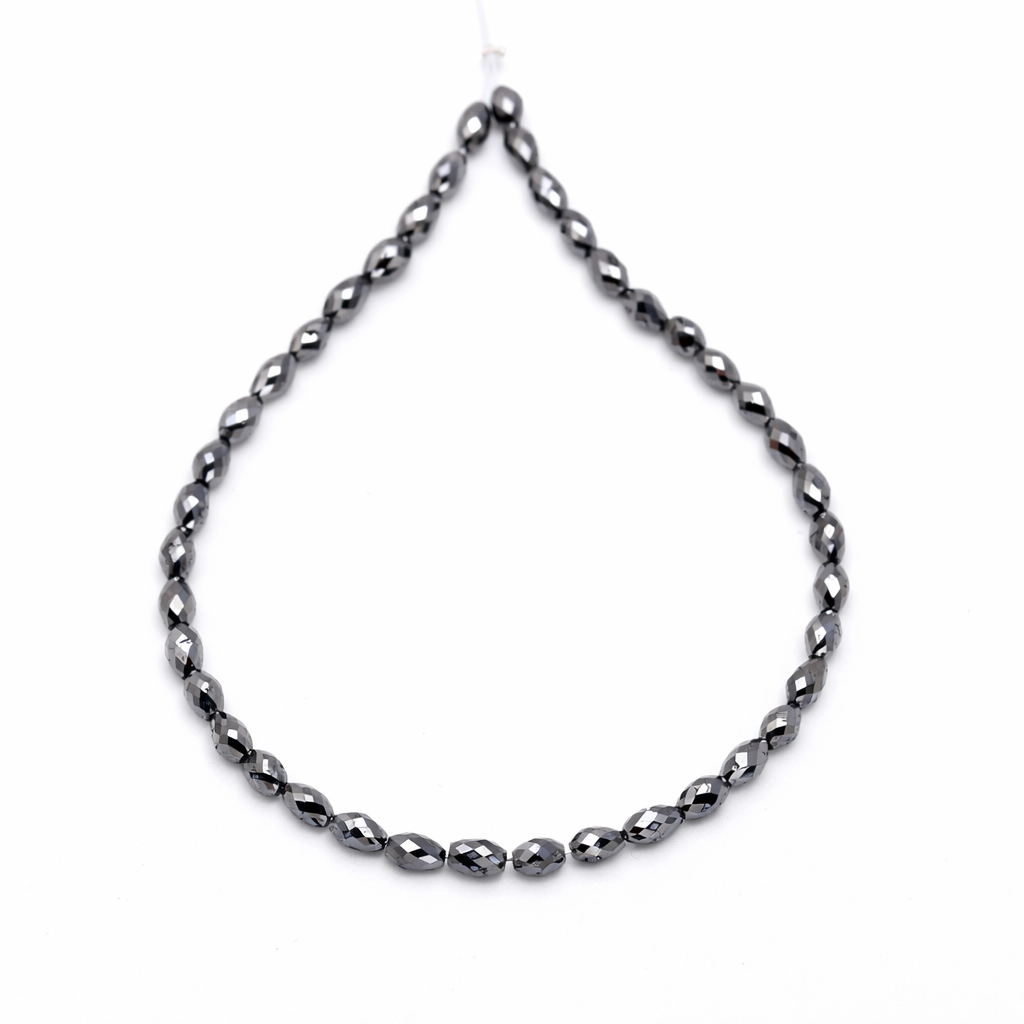 Black beaded necklace on a white background