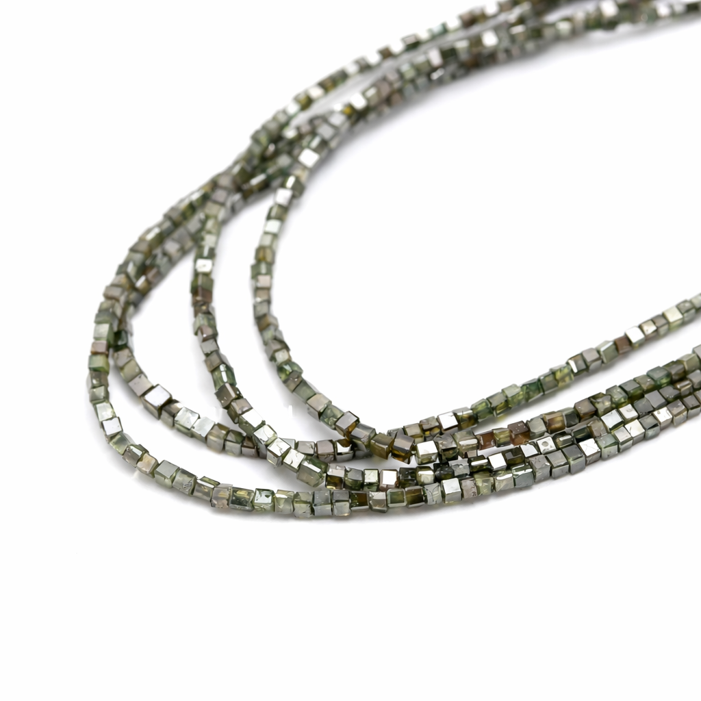 Three strands of small square beads on a white background