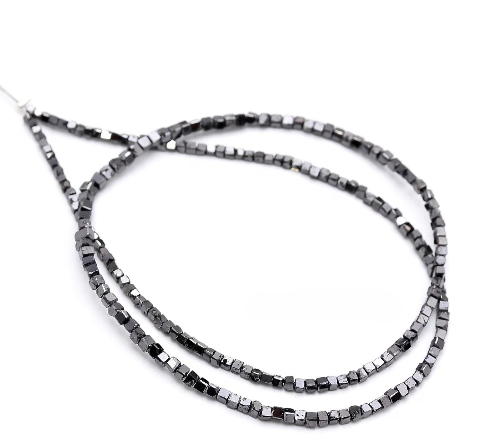 Two black beaded necklaces on a white background