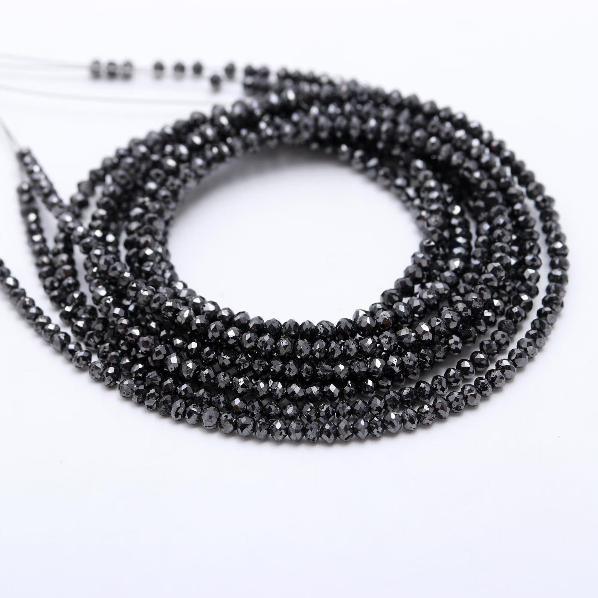 Black beaded necklace on a white background
