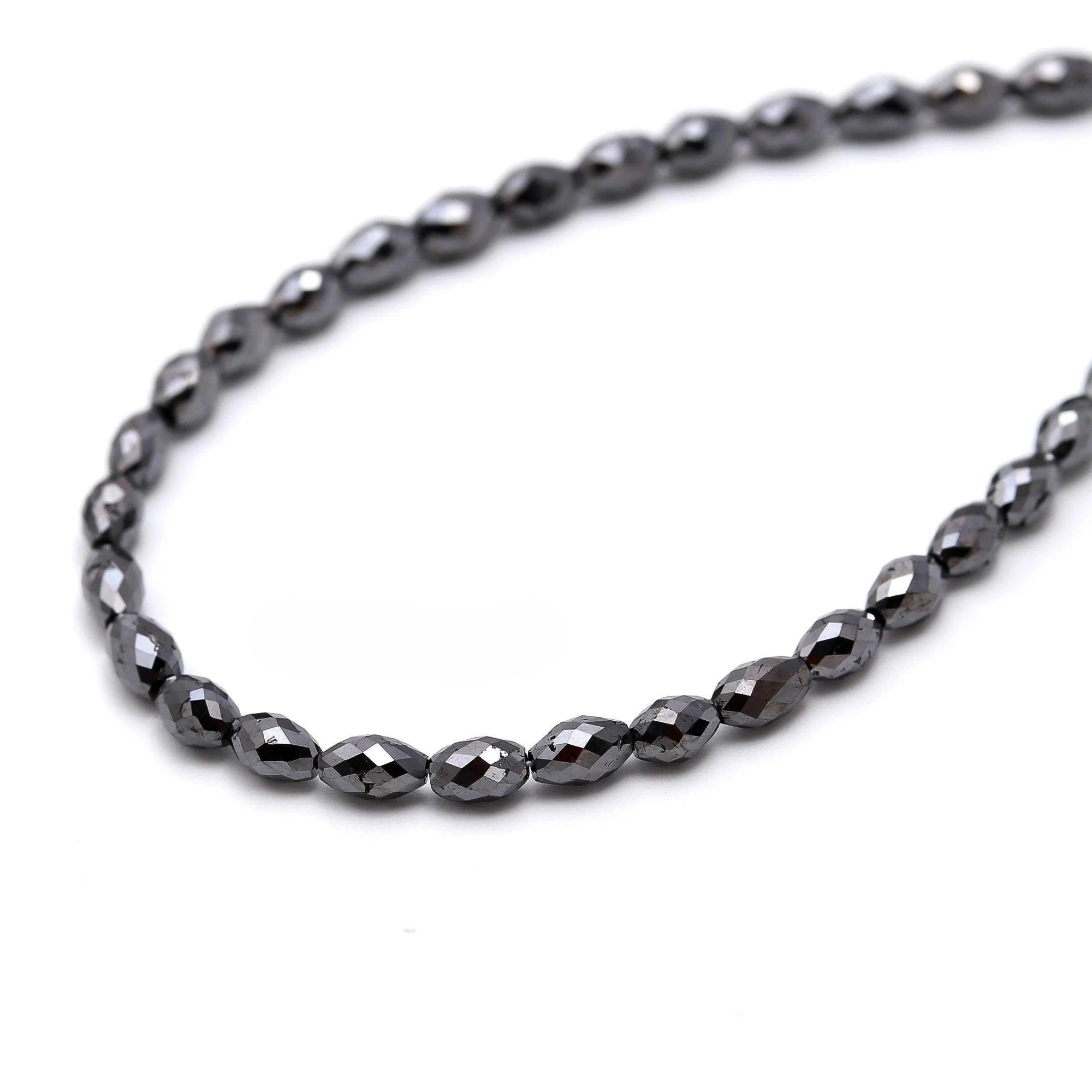 Necklace with dark beads on a white background