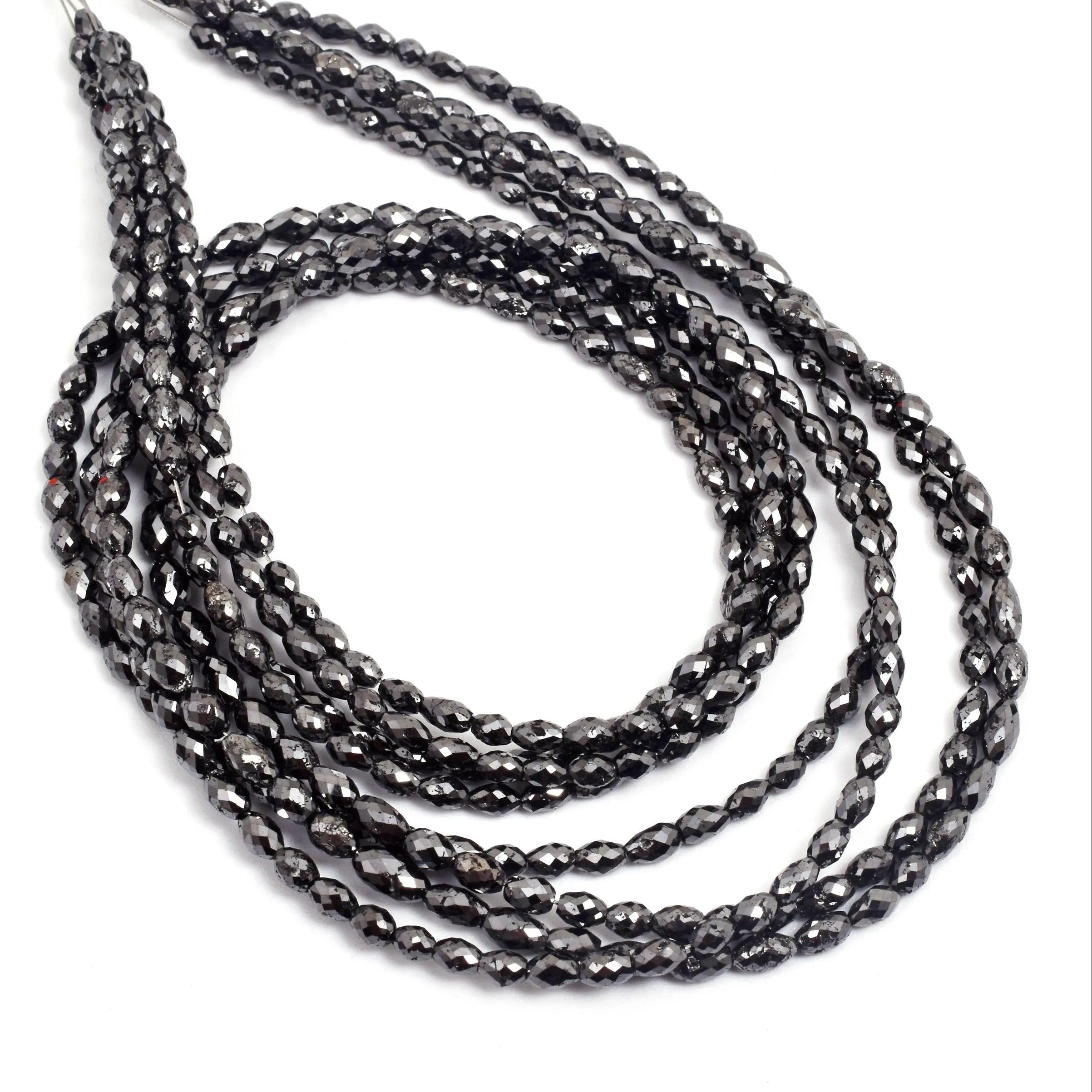 Black beaded necklace on a white background