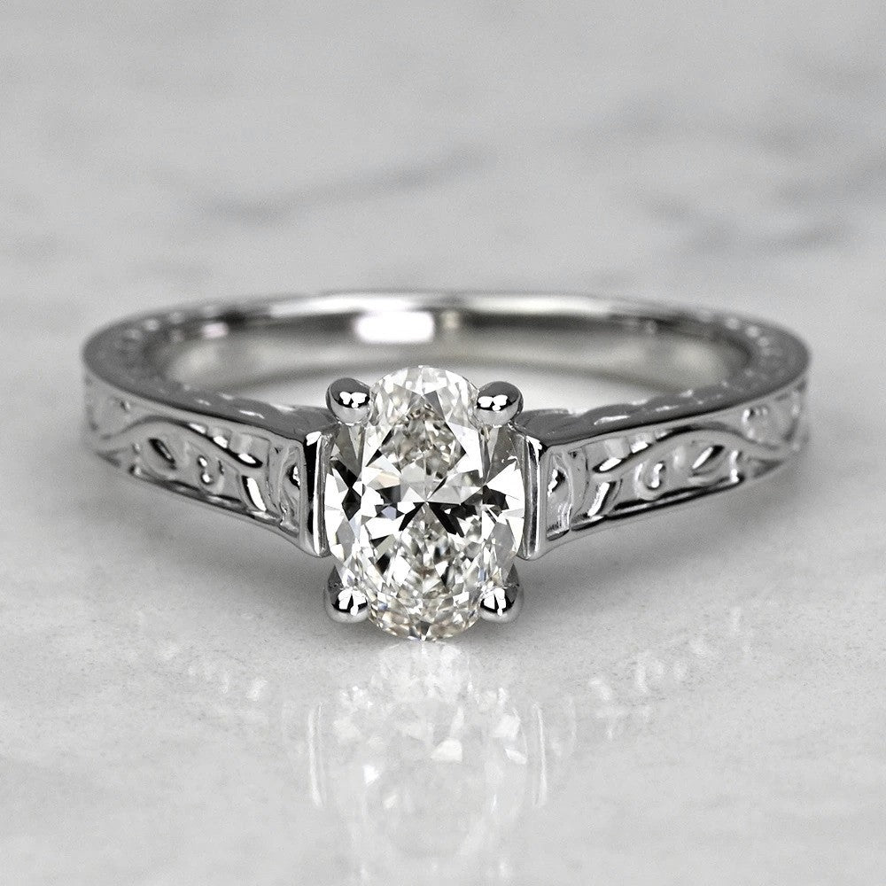 14k white gold ring with a diamond on a light gray background