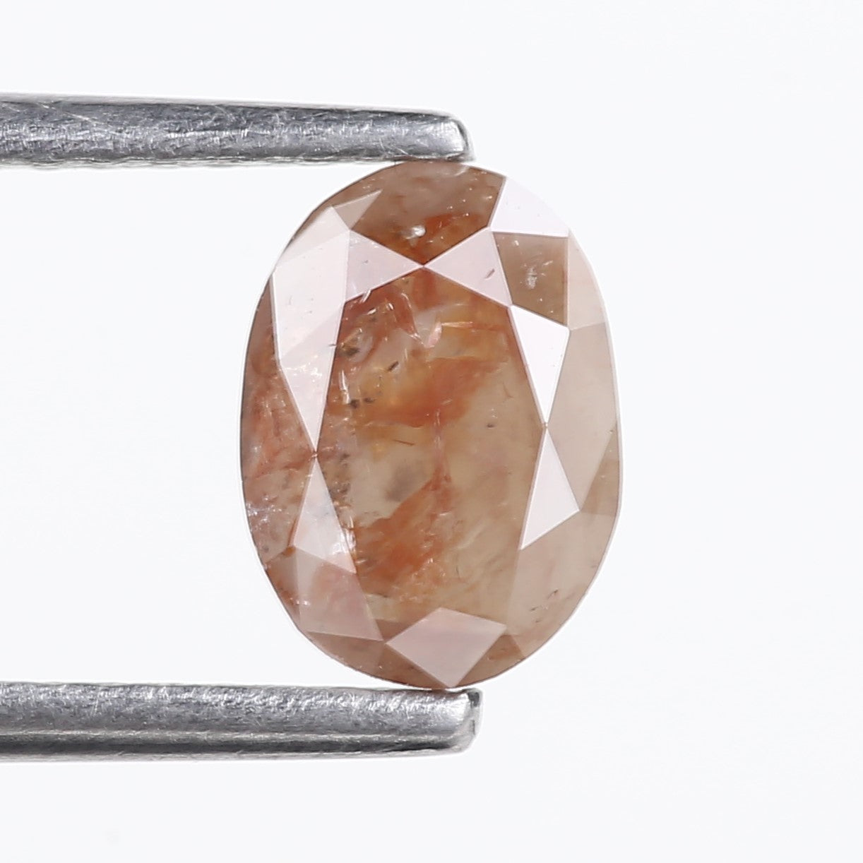 0.76 Carat Natural Orange Oval Cut Salt and Pepper Diamond 7.13 MM