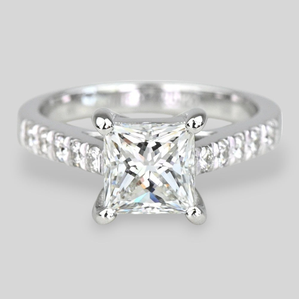 14k white gold with a clear Lab Diamond on a light gray 