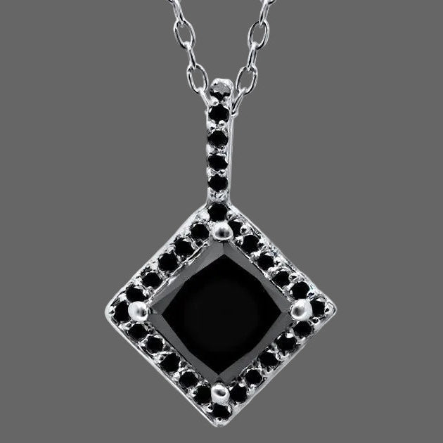 Black gemstone pendant with silver chain on a white background