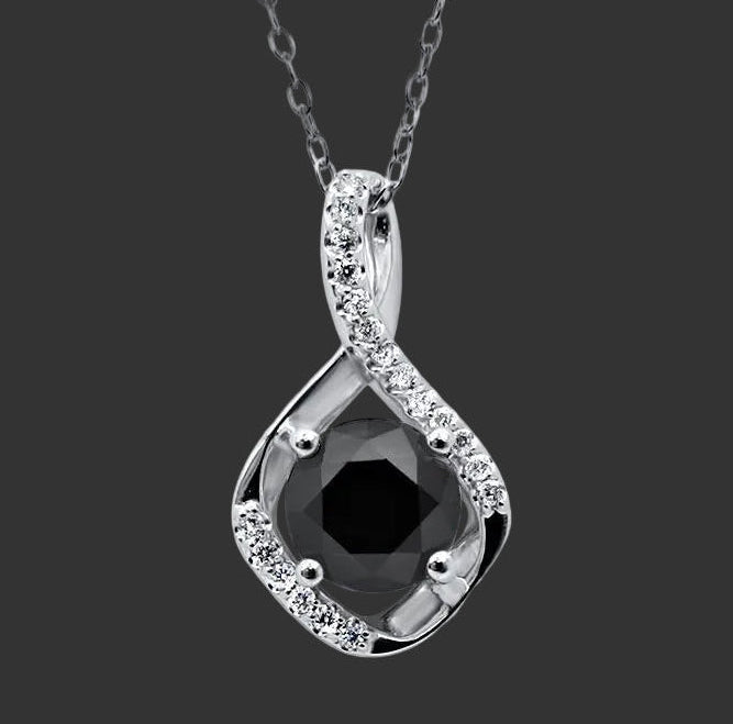 Black diamond pendant with white gold setting on a white background