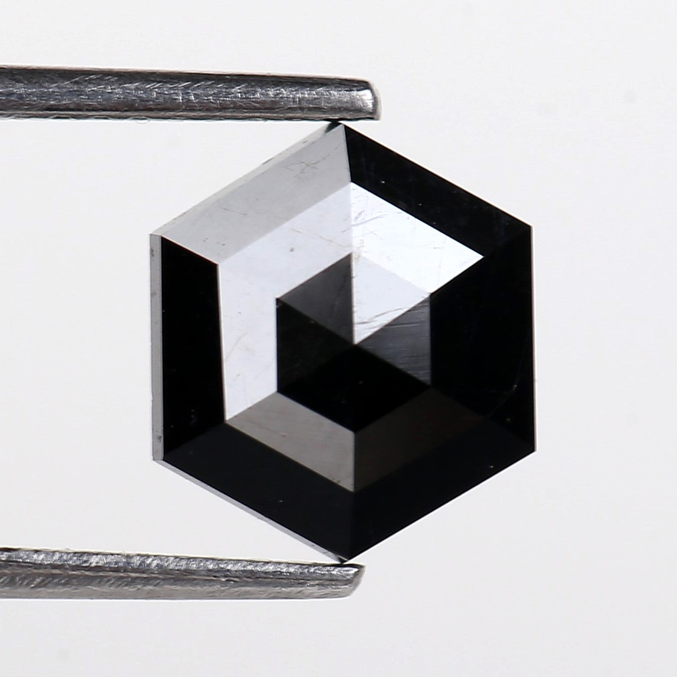 Black Hexagon with reflective properties on a white background